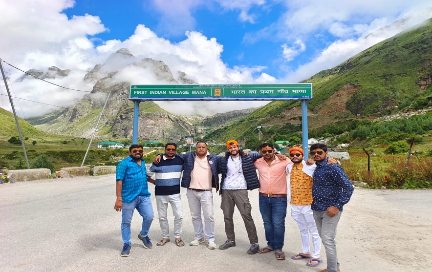 A group of people standing in front of Mana village that place comes near Badrinath