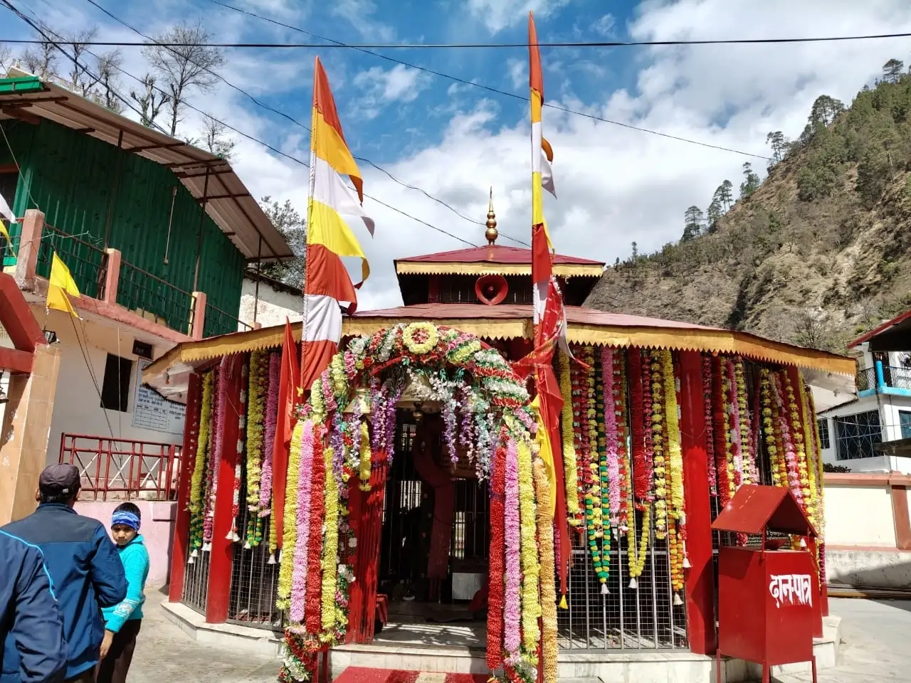 Kalimath temple front view beautifully decorated with flowers and flags