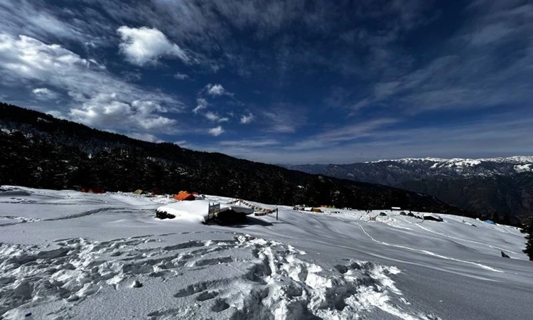 Beautiful view of snow covered mountains and grassland on Kedarkantha trek